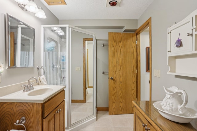 8671 Pheasant Run Rd, Woodbury, MN 55125 - full bath featuring vanity, a stall shower, tile patterned flooring, and a textured ceiling