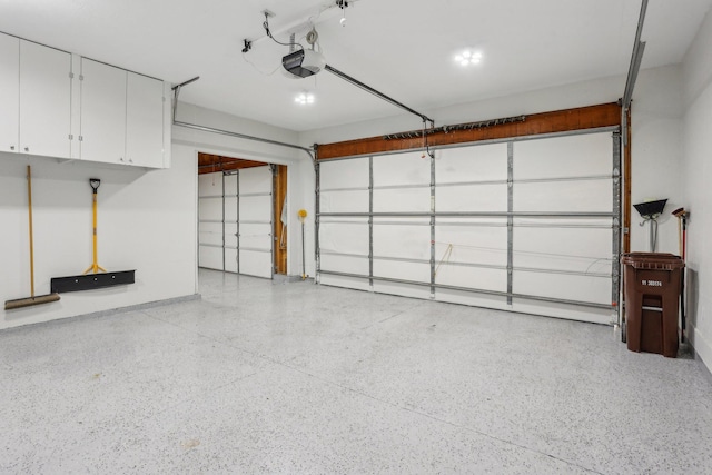 8671 Pheasant Run Rd, Woodbury, MN 55125 - garage featuring a garage door opener