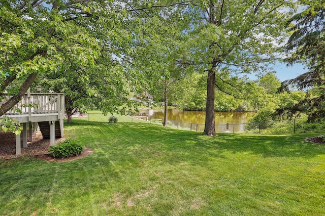 8671 Pheasant Run Rd, Woodbury, MN 55125 - view of yard with a deck with water view and stairway