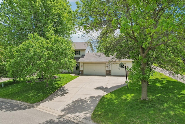 8671 Pheasant Run Rd, Woodbury, MN 55125 - obstructed view of property with driveway, an attached garage, and a front yard