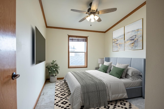 bedroom with ornamental molding, baseboards, a ceiling fan, and carpet