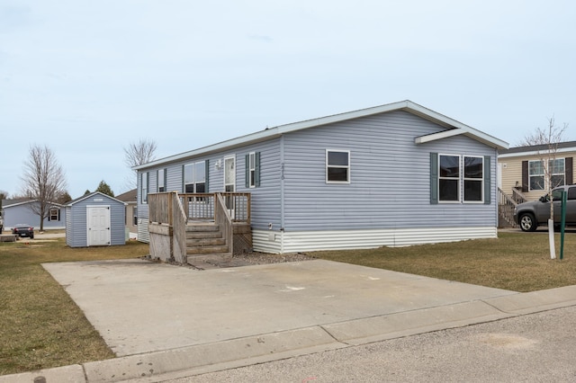 view of front of property with a storage shed, an outdoor structure, and a front lawn
