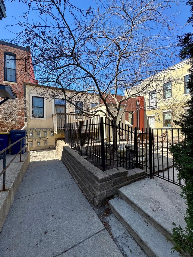 view of gate with fence