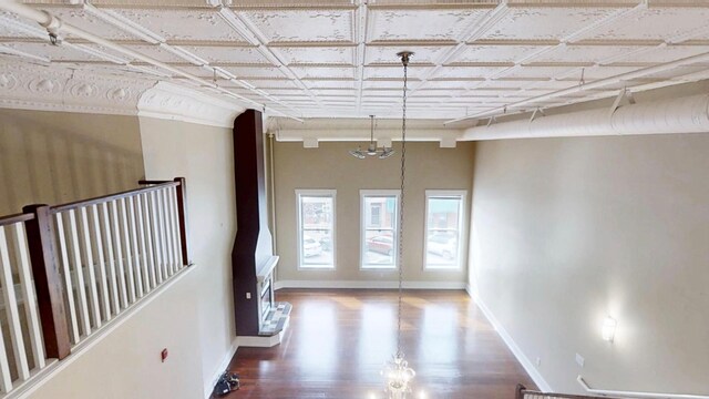 interior space featuring baseboards and wood finished floors