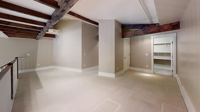 finished basement featuring visible vents and baseboards