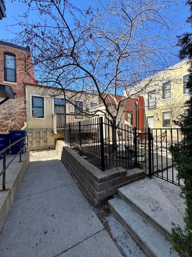 421 Division St S Unit 5, Northfield, MN 55057 - wooden terrace featuring a fenced front yard and a gate