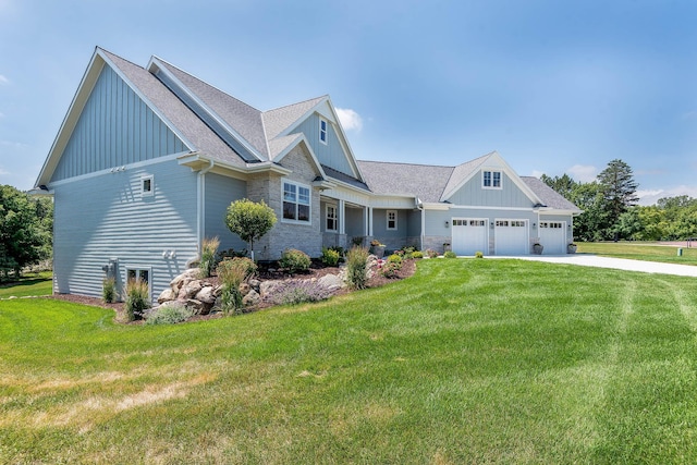 1005 Applewood Ct, Mankato, MN 56001 - view of front of house with driveway, a front yard, stone siding, an attached garage, and board and batten siding