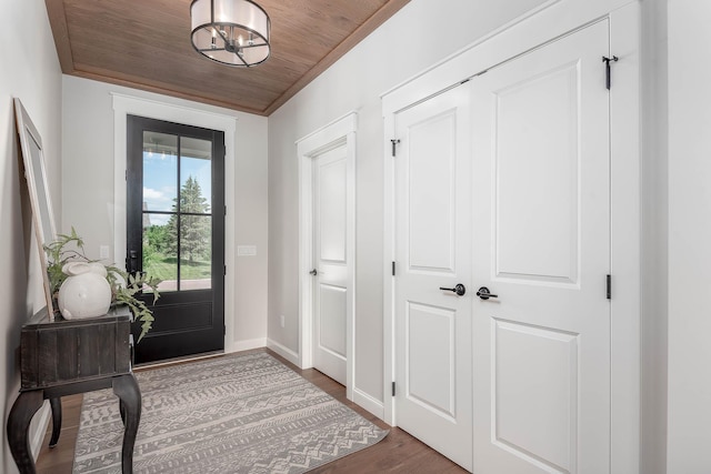 1005 Applewood Ct, Mankato, MN 56001 - foyer entrance with baseboards, a notable chandelier, wood finished floors, and wooden ceiling
