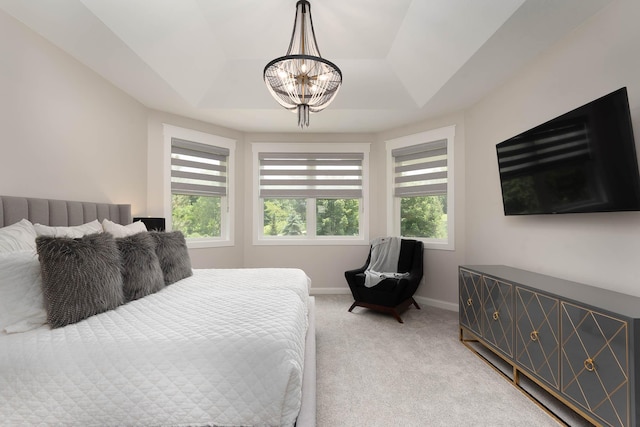 1005 Applewood Ct, Mankato, MN 56001 - bedroom with a tray ceiling, light colored carpet, a notable chandelier, and baseboards