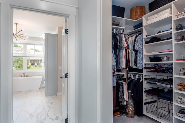 1005 Applewood Ct, Mankato, MN 56001 - spacious closet featuring marble finish floor and an inviting chandelier