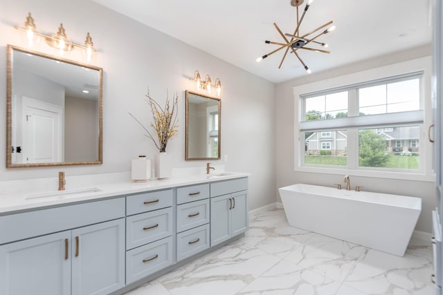 1005 Applewood Ct, Mankato, MN 56001 - bathroom featuring marble finish floor, a sink, double vanity, and a freestanding bath