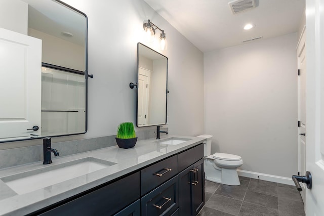 1005 Applewood Ct, Mankato, MN 56001 - full bathroom featuring toilet, a sink, and visible vents