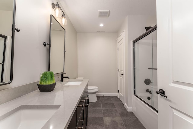 1005 Applewood Ct, Mankato, MN 56001 - bathroom with toilet, a sink, baseboards, and visible vents