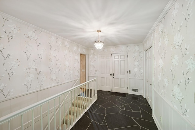 13907 Mcginty Rd E, Minnetonka, MN 55305 - corridor featuring wallpapered walls, wainscoting, a chandelier, dark tile patterned floors, and crown molding