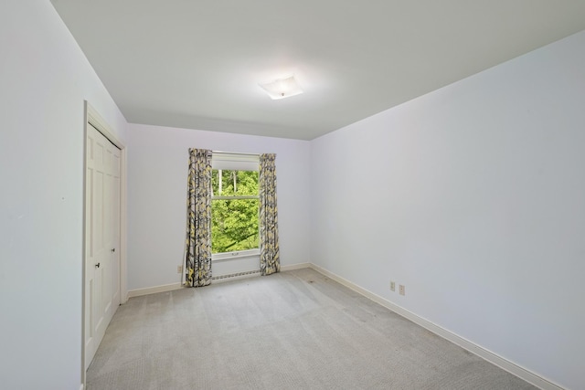 13907 Mcginty Rd E, Minnetonka, MN 55305 - unfurnished bedroom featuring baseboards and light carpet