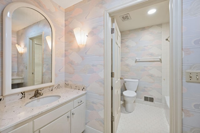 13907 Mcginty Rd E, Minnetonka, MN 55305 - bathroom featuring vanity, toilet, wallpapered walls, and tile patterned flooring