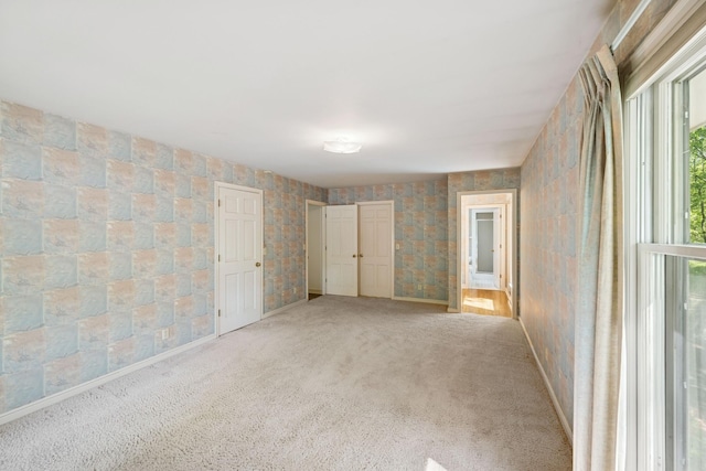 13907 Mcginty Rd E, Minnetonka, MN 55305 - unfurnished bedroom with light colored carpet and baseboards