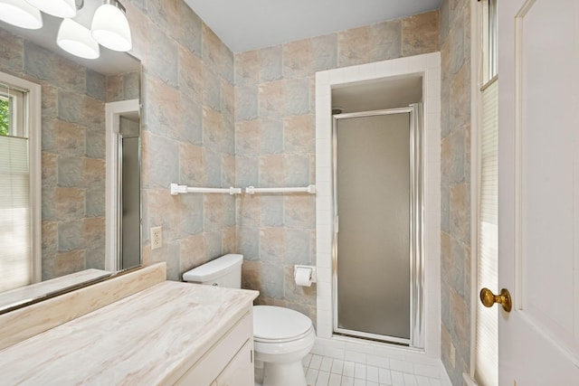 13907 Mcginty Rd E, Minnetonka, MN 55305 - bathroom featuring tile walls, vanity, toilet, a shower stall, and tile patterned flooring