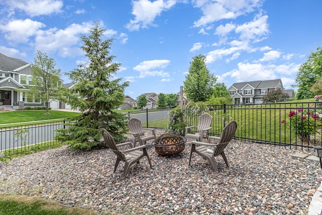 8831 Reflections Rd, Chanhassen, MN 55317 - view of patio / terrace with an outdoor fire pit and a residential view