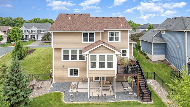 8831 Reflections Rd, Chanhassen, MN 55317 - back of house with stairway, a patio, a residential view, and a wooden deck