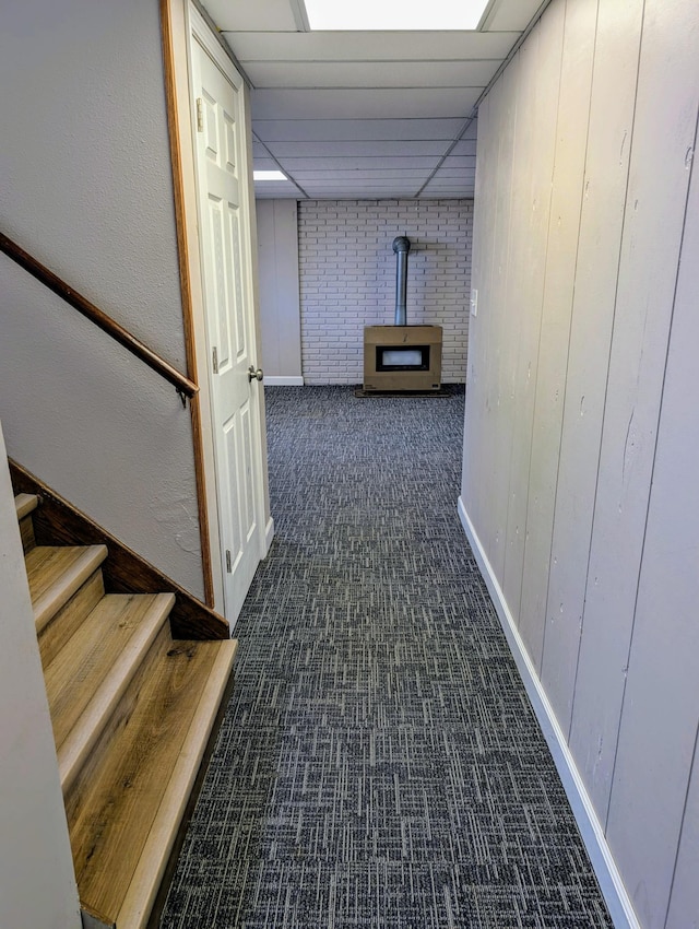 hall featuring baseboards, stairway, a paneled ceiling, and carpet