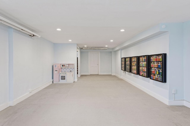 below grade area featuring baseboards, recessed lighting, and carpet floors