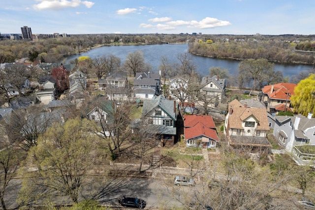 birds eye view of property featuring a water view and a residential view