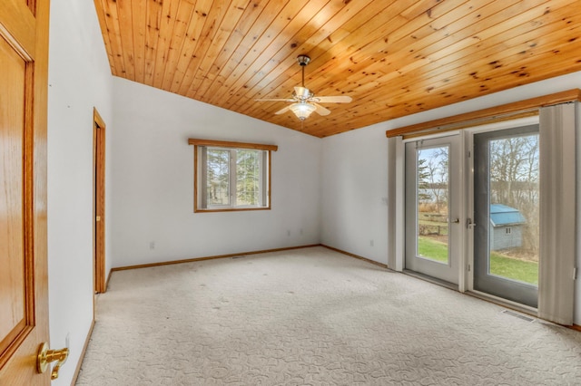 carpeted spare room with wooden ceiling, plenty of natural light, a ceiling fan, and lofted ceiling
