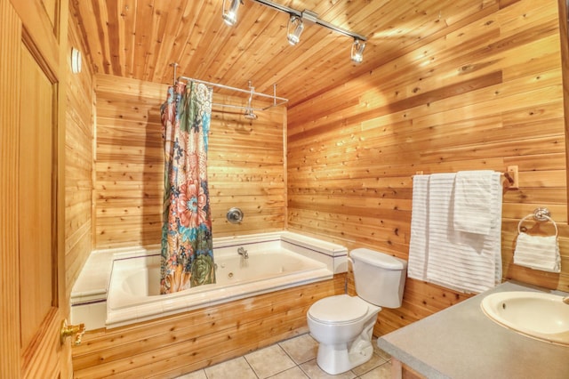full bathroom with a sink, toilet, tile patterned floors, tiled shower / bath combo, and rail lighting