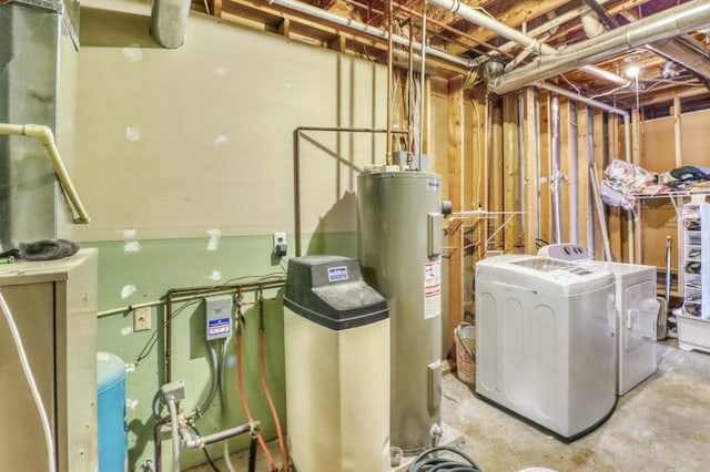 interior space with water heater and separate washer and dryer