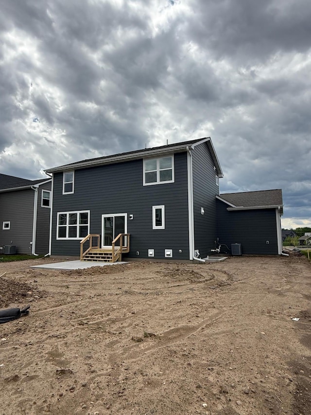 10124 Arrowwood Trl, Woodbury, MN 55129 - rear view of house with central AC unit