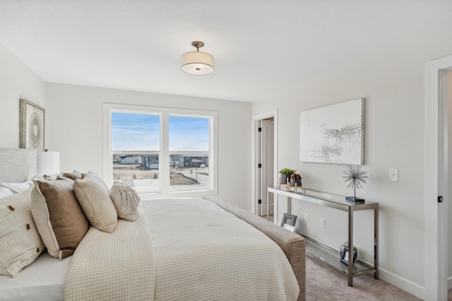 10124 Arrowwood Trl, Woodbury, MN 55129 - bedroom with light carpet and baseboards