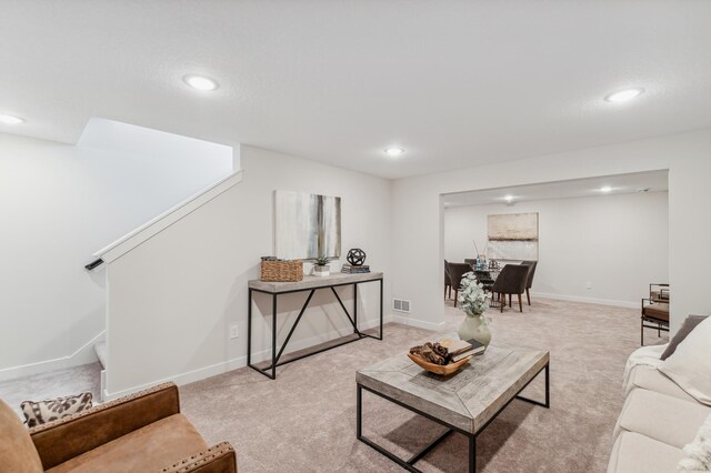 10124 Arrowwood Trl, Woodbury, MN 55129 - living room featuring recessed lighting, light colored carpet, baseboards, and stairs
