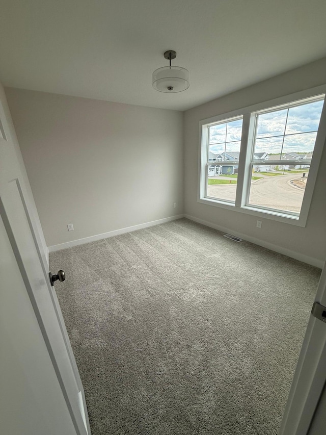 10124 Arrowwood Trl, Woodbury, MN 55129 - empty room with baseboards and carpet