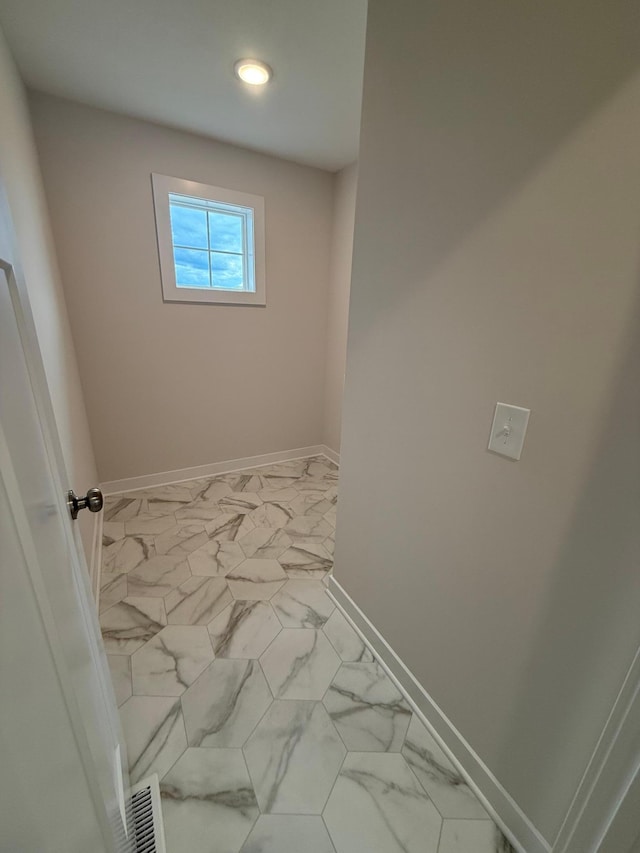 10124 Arrowwood Trl, Woodbury, MN 55129 - interior space with baseboards, marble look tile flooring, and recessed lighting