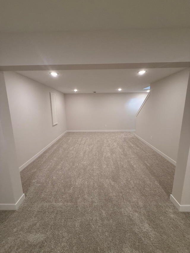 10124 Arrowwood Trl, Woodbury, MN 55129 - finished below grade area with carpet floors, baseboards, and recessed lighting