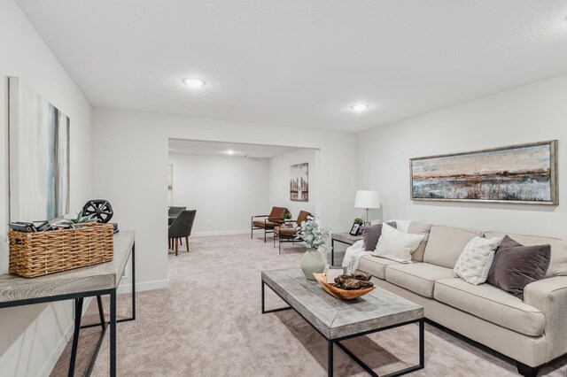 10124 Arrowwood Trl, Woodbury, MN 55129 - living room featuring light colored carpet, recessed lighting, and baseboards
