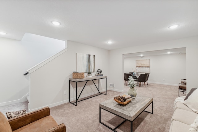 10124 Arrowwood Trl, Woodbury, MN 55129 - living area featuring recessed lighting, light carpet, baseboards, and stairs