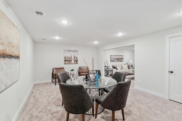 10124 Arrowwood Trl, Woodbury, MN 55129 - dining area with light colored carpet, baseboards, and recessed lighting