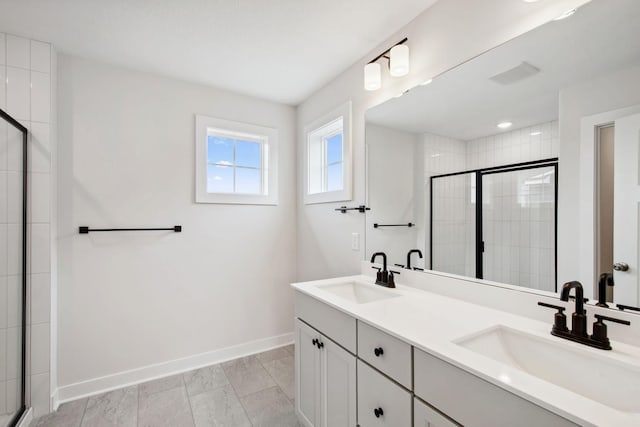 10124 Arrowwood Trl, Woodbury, MN 55129 - bathroom featuring baseboards, double vanity, and a shower stall