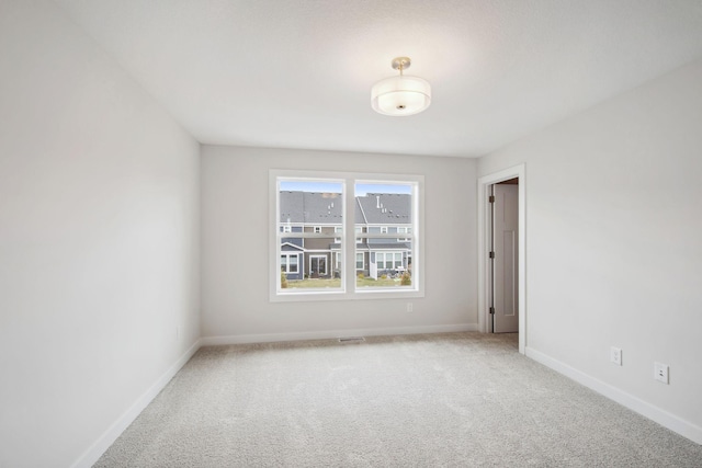 10124 Arrowwood Trl, Woodbury, MN 55129 - carpeted spare room with baseboards