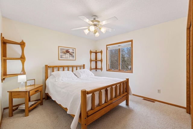 515 Greaton Rd, New Richmond, WI 54017 - carpeted bedroom with a textured ceiling and a ceiling fan