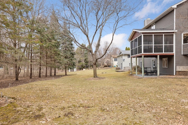 515 Greaton Rd, New Richmond, WI 54017 - view of green lawn with a sunroom and a patio area