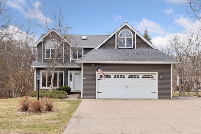 515 Greaton Rd, New Richmond, WI 54017 - view of front of property with a shingled roof, concrete driveway, a front yard, and an attached garage