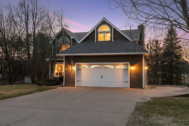 515 Greaton Rd, New Richmond, WI 54017 - view of front of house with driveway, a chimney, roof with shingles, and an attached garage