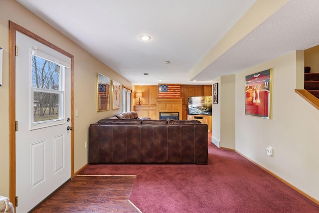 515 Greaton Rd, New Richmond, WI 54017 - living area featuring a fireplace, recessed lighting, and dark colored carpet