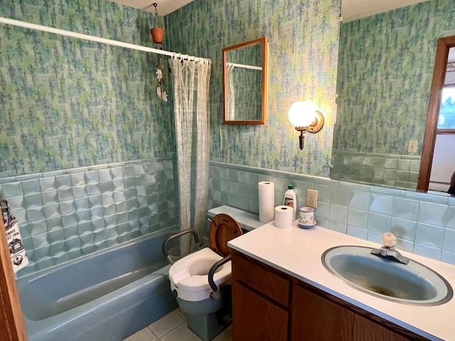 bathroom featuring wallpapered walls, toilet, vanity, tile walls, and shower / tub combo
