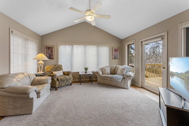 13162 Glenhaven Ave, Apple Valley, MN 55124 - living area with vaulted ceiling, ceiling fan, light colored carpet, and baseboards
