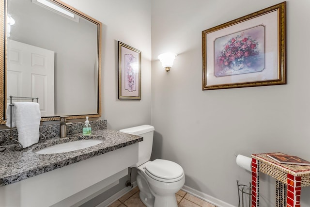 13162 Glenhaven Ave, Apple Valley, MN 55124 - half bathroom with tile patterned flooring, toilet, vanity, and baseboards