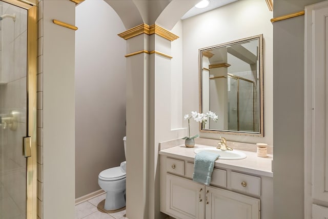 13162 Glenhaven Ave, Apple Valley, MN 55124 - bathroom featuring a stall shower, toilet, vanity, and tile patterned floors